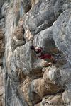 Cathrin is trying hard in a 7b at Makinodromo
