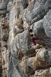 Cathrin is trying hard in a 7b at Makinodromo