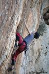 Cathrin in a skin eating 7a+ at Desplomilandia